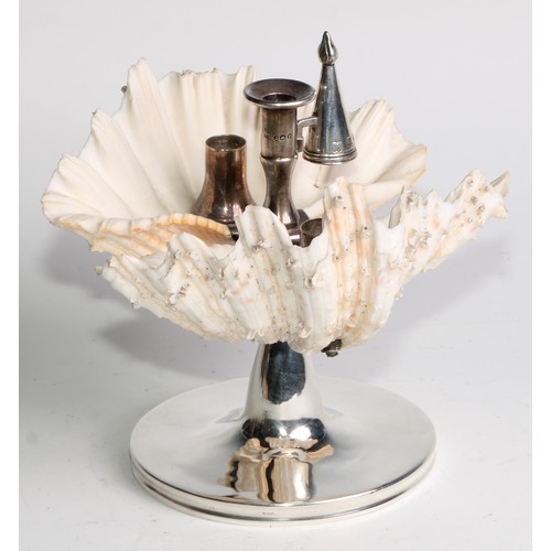 1193 - An unusual George III silver conchological chamberstick, incorporating a pair of exotic sea shells, ... 