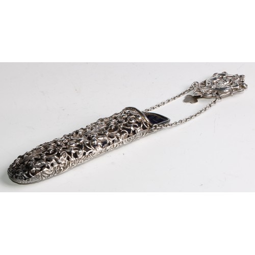 844 - An Edwardian silver plated chatelaine spectacles case, embossed with figures, a mask and leafy folia... 