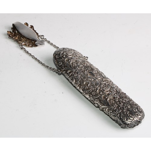 844 - An Edwardian silver plated chatelaine spectacles case, embossed with figures, a mask and leafy folia... 