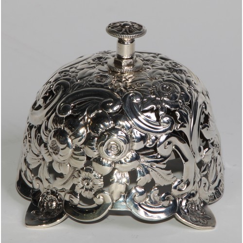 1090 - A Victorian silver desk or counter bell, pierced and profusely chased with flowers and scrolling fol... 