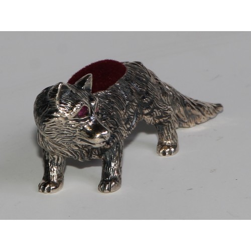 1075 - A sterling silver novelty pin cushion, as a fox, ruby eyes, 6cm long