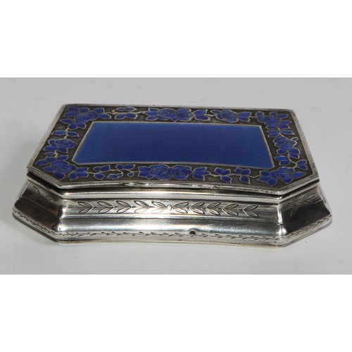 1145 - An early 20th century French silver and enamel lozenge shaped snuff box, hinged cover with blue guil... 