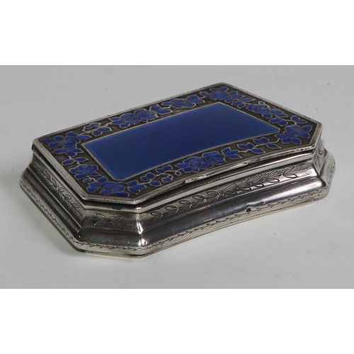 1145 - An early 20th century French silver and enamel lozenge shaped snuff box, hinged cover with blue guil... 