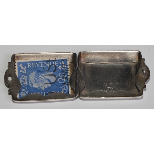 975 - A George V silver rounded rectangular stamp case, quite plain, 3cm wide, Birmingham 1915