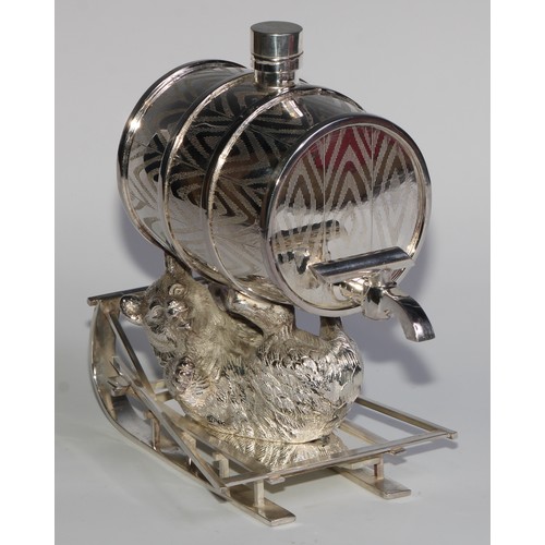 829 - A silver plated novelty spirit barrel, amusingly modelled as a bear reclining on a sledge, 22cm long