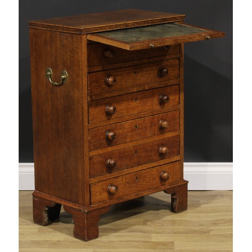 2659 - An Arts & Crafts period oak collector’s specimen chest, rectangular top above a slide and six long d... 