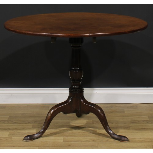 1707 - A 19th century mahogany tripod occasional table, one-piece circular tilting top, turned column, cabr... 