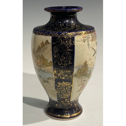 473 - A pair of Japanese satsuma baluster vases, decorated with traditional landscape and bird panels, blu... 