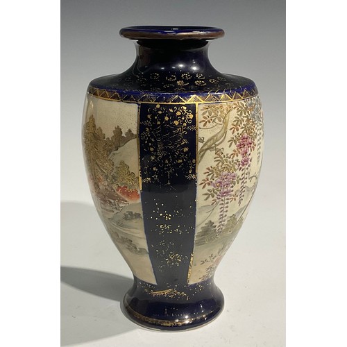 473 - A pair of Japanese satsuma baluster vases, decorated with traditional landscape and bird panels, blu... 