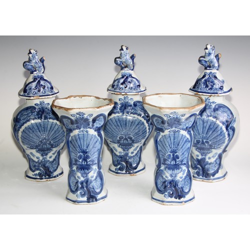 290 - A Delftware five piece garniture, boldly decorated in underglaze blue, the largest 36cm high (5)