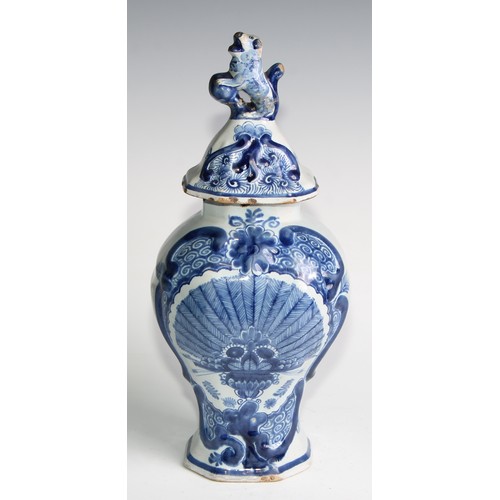 290 - A Delftware five piece garniture, boldly decorated in underglaze blue, the largest 36cm high (5)