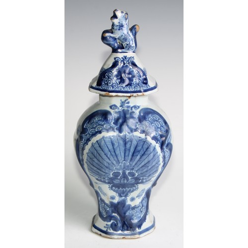 290 - A Delftware five piece garniture, boldly decorated in underglaze blue, the largest 36cm high (5)