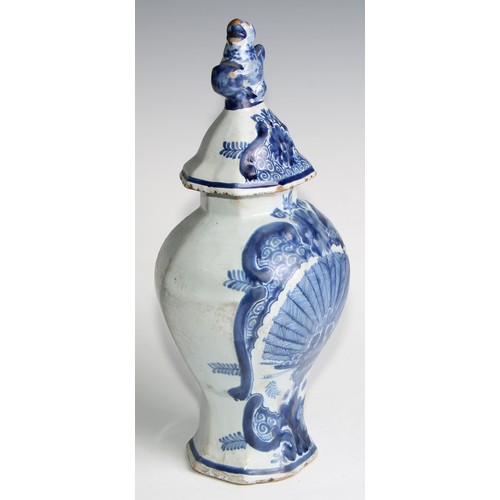 290 - A Delftware five piece garniture, boldly decorated in underglaze blue, the largest 36cm high (5)