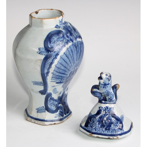 290 - A Delftware five piece garniture, boldly decorated in underglaze blue, the largest 36cm high (5)