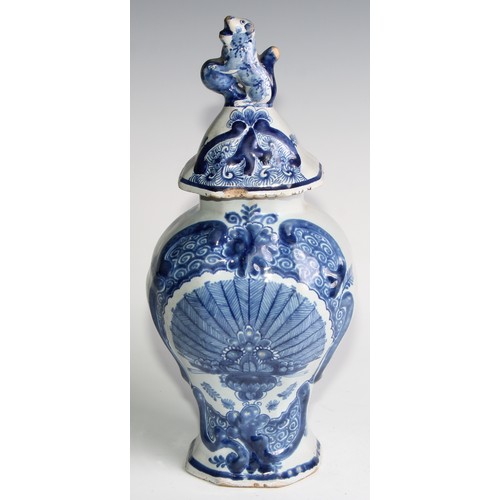 290 - A Delftware five piece garniture, boldly decorated in underglaze blue, the largest 36cm high (5)