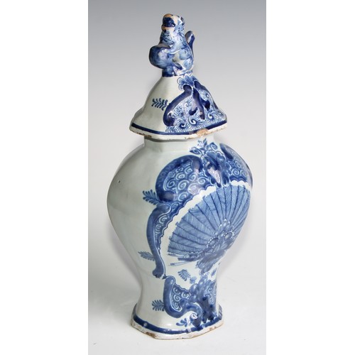 290 - A Delftware five piece garniture, boldly decorated in underglaze blue, the largest 36cm high (5)