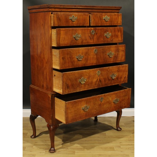 2107 - A George II Revival walnut chest on stand, moulded cornice above two short and three long graduated ... 