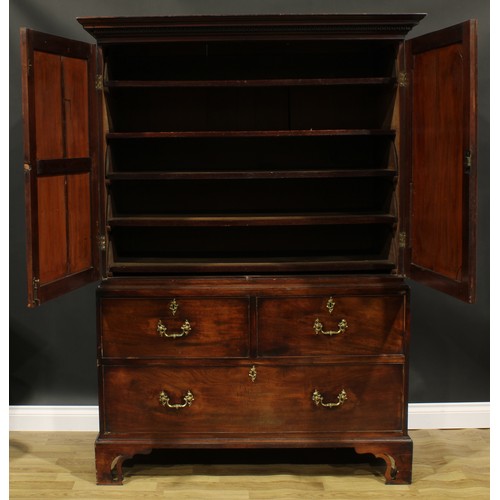 1633 - A 19th century mahogany linen press, outswept cornice with meandrous capital above a pair of panel d... 