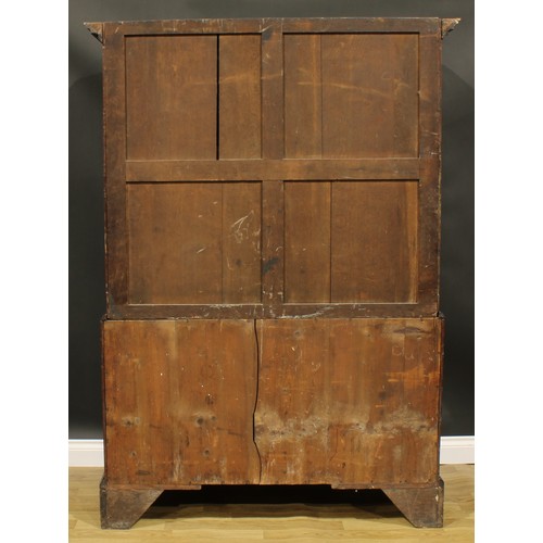 1633 - A 19th century mahogany linen press, outswept cornice with meandrous capital above a pair of panel d... 