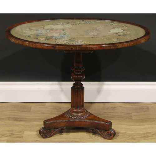 2618 - A William IV rosewood and mahogany low occasional table, oval top with glazed needlework panel, turn... 