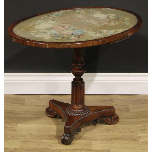 2618 - A William IV rosewood and mahogany low occasional table, oval top with glazed needlework panel, turn... 