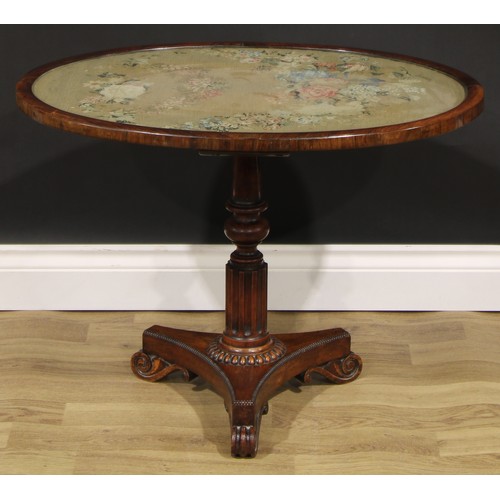 2618 - A William IV rosewood and mahogany low occasional table, oval top with glazed needlework panel, turn... 