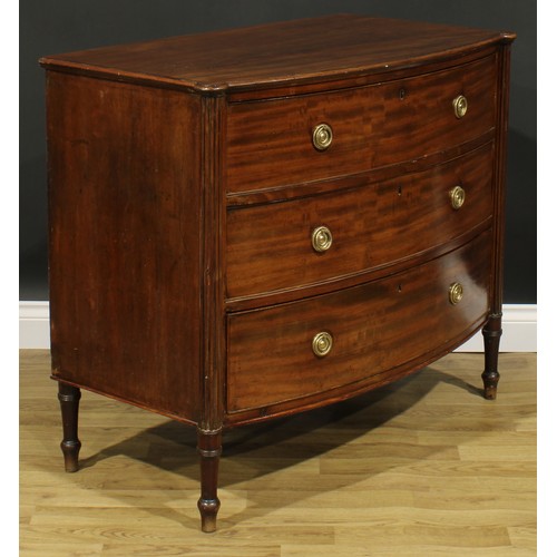 2357 - A Regency mahogany bowfront chest, slightly oversailing top above three long graduated cockbeaded dr... 