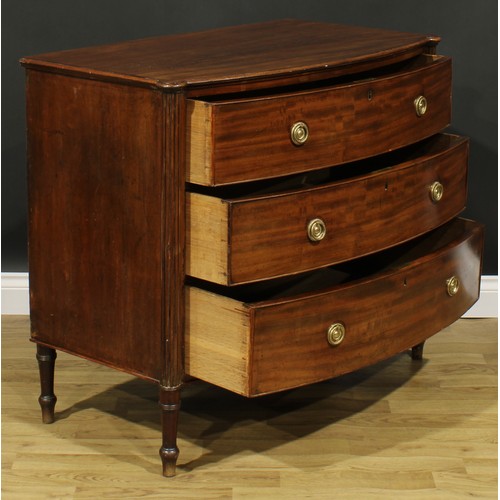 2357 - A Regency mahogany bowfront chest, slightly oversailing top above three long graduated cockbeaded dr... 