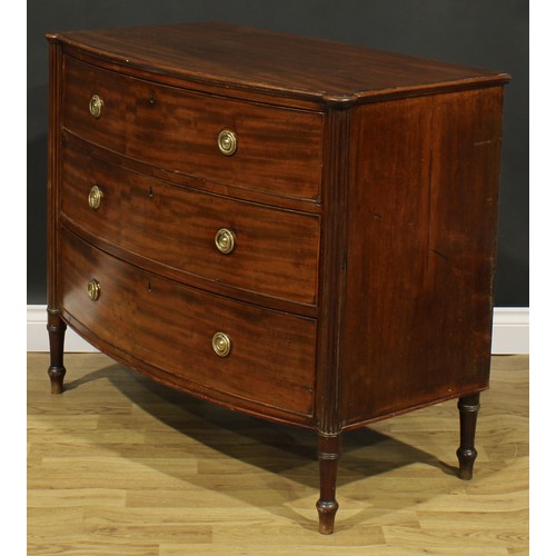 2357 - A Regency mahogany bowfront chest, slightly oversailing top above three long graduated cockbeaded dr... 