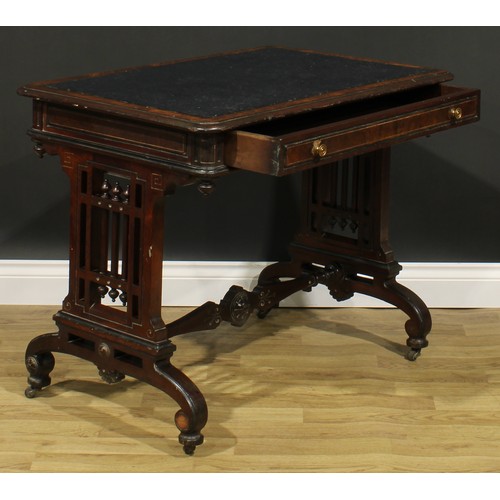 1843 - A late Victorian Aesthetic Movement walnut and mahogany writing table, rounded rectangular top above... 