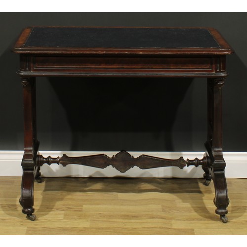 1843 - A late Victorian Aesthetic Movement walnut and mahogany writing table, rounded rectangular top above... 