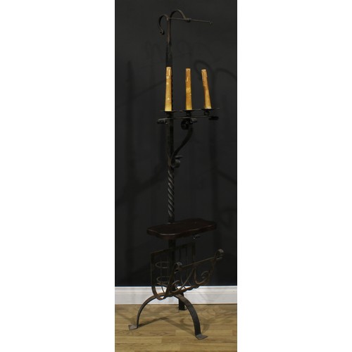 1906 - Interior Design - an 18th century style wrought iron tripod floor lamp, 186.5cm high overall