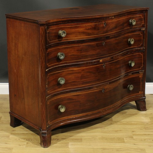 2462 - A George III mahogany serpentine chest, slightly oversailing top above four long graduated drawers, ... 