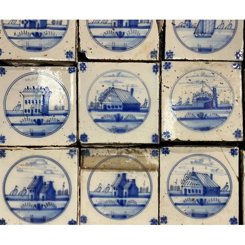 2545 - A quantity of Delftware blue and white tiles, predominantly decorated in the traditional manner with... 