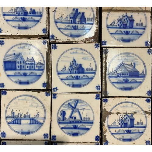 2545 - A quantity of Delftware blue and white tiles, predominantly decorated in the traditional manner with... 