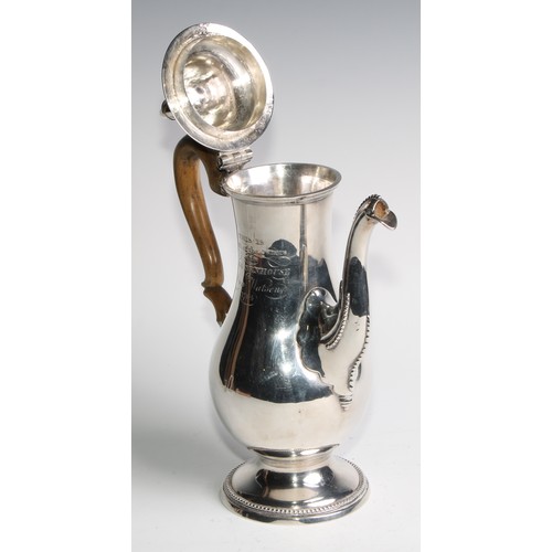 910 - A George III Provincial silver baluster coffee pot, hinged domed cover with acorn finial, beaded bor... 