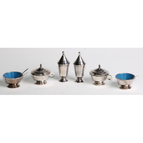 1129 - An Art Deco silver six piece condiment set, comprising pairs of mustards, salts and peppers, the lat... 