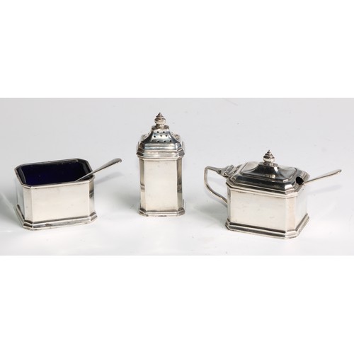 1127 - An Art Deco silver canted rectangular three piece condiment set, comprising sat, pepper and mustard,... 