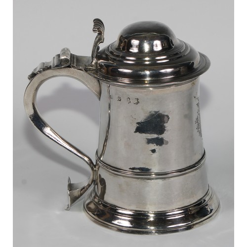 906 - A George II silver tankard, hinged domed cover with scroll  thumbpiece, three-quarter girdle, scroll... 