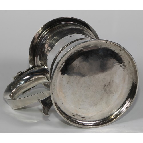 906 - A George II silver tankard, hinged domed cover with scroll  thumbpiece, three-quarter girdle, scroll... 