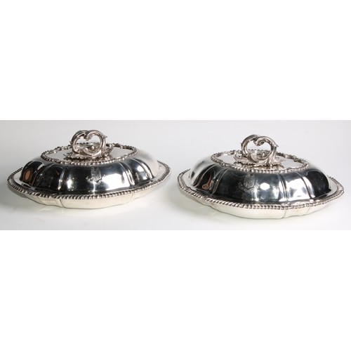 1033 - A pair of Victorian fluted oval entree dishes, acanthus scroll bayonet loop handles, gadrooned borde... 