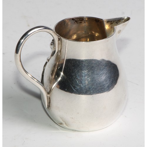 1030 - A pair of German Art Nouveau silver sparrow beak cream jugs, applied with stylised lilies in whiplas... 