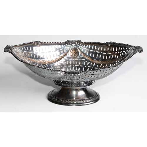 1078 - A Victorian Adam Revival silver boat shaped pedestal cake dish, pierced and embossed with swags and ... 