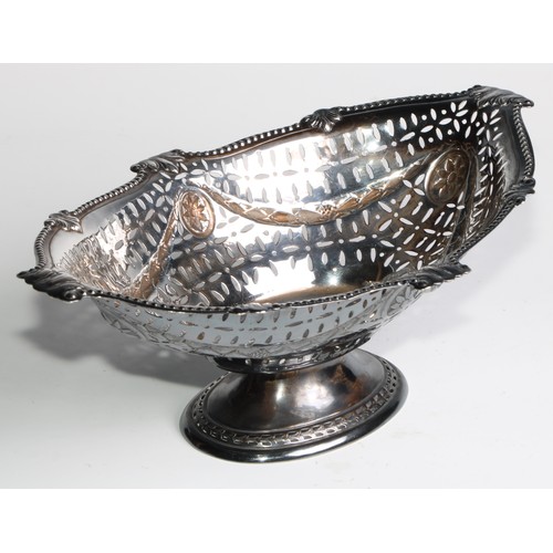 1078 - A Victorian Adam Revival silver boat shaped pedestal cake dish, pierced and embossed with swags and ... 