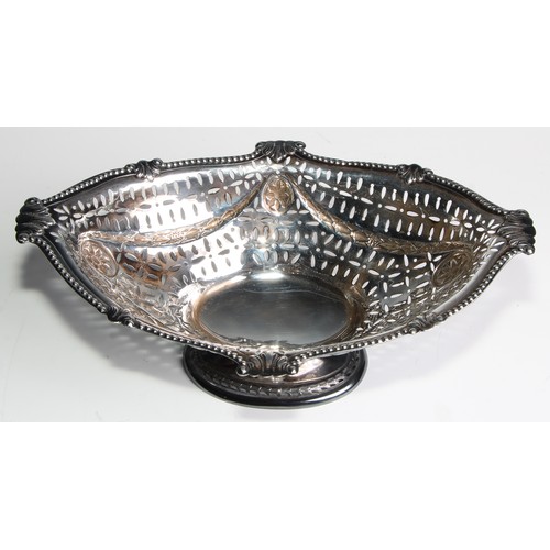 1078 - A Victorian Adam Revival silver boat shaped pedestal cake dish, pierced and embossed with swags and ... 