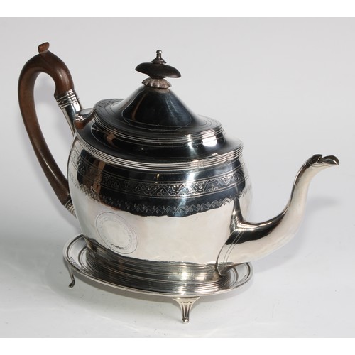 935 - A George III silver oval teapot and stand, bright-cut and wriggle-work engraved throughout, hinged d... 