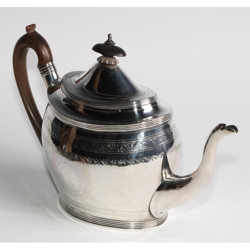 935 - A George III silver oval teapot and stand, bright-cut and wriggle-work engraved throughout, hinged d... 