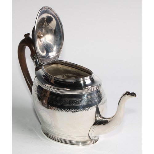 935 - A George III silver oval teapot and stand, bright-cut and wriggle-work engraved throughout, hinged d... 