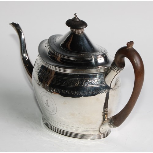 935 - A George III silver oval teapot and stand, bright-cut and wriggle-work engraved throughout, hinged d... 