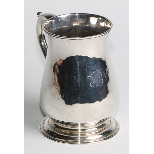 897 - A George II silver bell shaped mug, scroll-capped handle, skirted base, 12cm high, London 1748, 308g